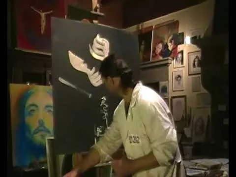 Alessio Atzeni dipinge dal vivo durante una sessione di speed painting